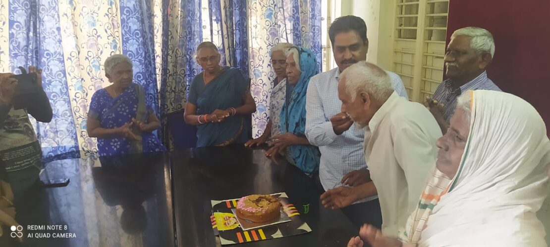 Sharing love by giving cake to elderly peron